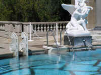 They've added a modern stair to the pool to avoid wear on the original marble ones