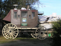 Customized stagecoach with Winegard TV antenna and MaxAir roof vent