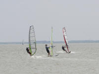 Chris (in the middle) sailing during the Austin Windsurf Club weekend trip.