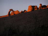 The fragile arch shows off its dramatic colors at sunset.