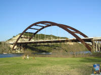 The Pennybacker bridge spans clear across Lake Austin